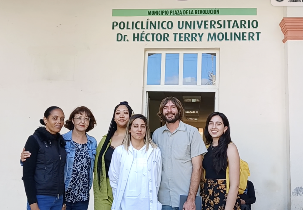 Hatuey members with Dr. Márquez Estévez (center) and Mariela Ortiz Montero (left), who works giving attention to the community served by the Dr. Hector Terry Molinert University Polyclinic in Havana.